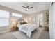 Bright bedroom with a ceiling fan, modern decor, and ensuite bathroom, creating a relaxing retreat at 1340 W 68Th Ave, Denver, CO 80221