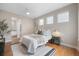 Cozy bedroom with modern furniture, plush bedding, and abundant natural light at 1340 W 68Th Ave, Denver, CO 80221