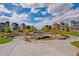 Beautiful community area with seating, water feature, and modern townhomes at 1340 W 68Th Ave, Denver, CO 80221