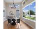 Cozy dining area with chandelier, large windows, and modern decor at 1340 W 68Th Ave, Denver, CO 80221