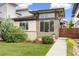 Modern home featuring a well-manicured lawn and a unique architectural design with ample natural light at 1340 W 68Th Ave, Denver, CO 80221