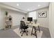 Functional office space featuring a streamlined desk setup, ample lighting, and comfortable seating at 1340 W 68Th Ave, Denver, CO 80221