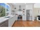 Clean kitchen with stainless steel appliances, light countertops and open shelving at 1340 W 68Th Ave, Denver, CO 80221