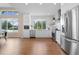Bright white kitchen features stainless steel appliances and ample natural light at 1340 W 68Th Ave, Denver, CO 80221