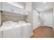 Functional laundry room with modern appliances, ample storage, and convenient access to the house at 1340 W 68Th Ave, Denver, CO 80221