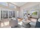 Spacious living room flowing to an outdoor patio with floor to ceiling windows throughout at 1340 W 68Th Ave, Denver, CO 80221