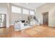 Bright, open living room with vaulted ceilings and hardwood floors throughout the living area at 1340 W 68Th Ave, Denver, CO 80221