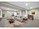 Basement living room with a comfortable sitting area, foosball table, and stylish decor at 1340 W 68Th Ave, Denver, CO 80221