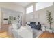 Bright, open living room with vaulted ceilings and hardwood floors throughout the living area at 1340 W 68Th Ave, Denver, CO 80221