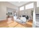 Inviting living room with high ceilings, abundant light, and a view into the modern, open-concept kitchen at 1340 W 68Th Ave, Denver, CO 80221