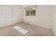 Bright bedroom with neutral walls features double closets and a window providing natural light at 15789 Sandtrap Way, Morrison, CO 80465