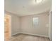 Bedroom with bright natural light featuring a full ensuite bathroom at 15789 Sandtrap Way, Morrison, CO 80465