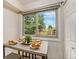 Bright breakfast nook featuring an outside view, table, and a view of the backyard at 15789 Sandtrap Way, Morrison, CO 80465