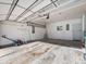 Spacious, well-lit garage with ample storage space and work area at 15789 Sandtrap Way, Morrison, CO 80465