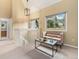 Cozy loft area with vaulted ceilings, neutral decor, and views to the outside at 15789 Sandtrap Way, Morrison, CO 80465