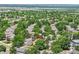 Overview of a home site situated amongst lush trees and within a residential area at 9717 Castle Ridge Cir, Highlands Ranch, CO 80129