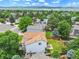 Expansive aerial view of a home with a large lawn and deck in a lush, green neighborhood at 9717 Castle Ridge Cir, Highlands Ranch, CO 80129