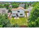 Well-maintained fenced backyard with a patio, landscaping, and an outdoor dining area at 9717 Castle Ridge Cir, Highlands Ranch, CO 80129