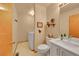 Charming bathroom featuring a toilet, sink, vanity, and in-room laundry hookups with neutral colored walls at 9717 Castle Ridge Cir, Highlands Ranch, CO 80129