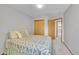 Bright bedroom includes a double closet with paneled doors and easy access to adjacent rooms at 9717 Castle Ridge Cir, Highlands Ranch, CO 80129