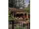 Backyard patio featuring an outdoor dining set under a pergola, with a fountain at 1275 N Franklin St, Denver, CO 80218