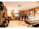 Finished basement with exposed brick wall and musical instruments at 1275 N Franklin St, Denver, CO 80218