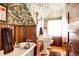 Charming bathroom featuring wood paneled walls, hardwood floors, and a classic clawfoot tub at 1275 N Franklin St, Denver, CO 80218