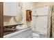 Bathroom features a white tiled shower, vanity with a brown marble countertop, and a round mirror at 1275 N Franklin St, Denver, CO 80218