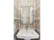 Bathroom sink with modern fixtures and decorative wallpaper at 1275 N Franklin St, Denver, CO 80218