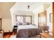Charming bedroom with wood trim, hardwood floors, and bright windows at 1275 N Franklin St, Denver, CO 80218