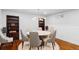 Bright dining room features a modern chandelier, seating for seven, and built-in bookcases at 1275 N Franklin St, Denver, CO 80218