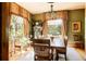 Formal dining room featuring large windows, hardwood floors, and a stylish chandelier, ideal for entertaining at 1275 N Franklin St, Denver, CO 80218