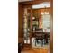 Inviting dining room showcasing a wood table, chairs, china cabinet, and decorative window treatments at 1275 N Franklin St, Denver, CO 80218