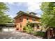 Beautiful two-story brick home with a well-manicured lawn and a detached two-car garage at 1275 N Franklin St, Denver, CO 80218