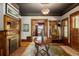 Elegant foyer featuring a grand round table, decorative fireplace, and ornate vintage light fixture at 1275 N Franklin St, Denver, CO 80218
