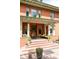 Inviting front porch with comfortable seating, potted plants, and decorative columns, perfect for relaxing outdoors at 1275 N Franklin St, Denver, CO 80218