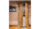 Brick-walled basement with a secret room and a decorative picture frame at 1275 N Franklin St, Denver, CO 80218