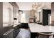 Modern kitchen featuring stainless steel appliances, a large island, and ample counter space, perfect for cooking at 1275 N Franklin St, Denver, CO 80218