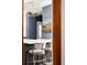 Modern kitchen featuring a breakfast bar with seating, sleek countertops, and stylish decor at 1275 N Franklin St, Denver, CO 80218