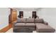 Finished basement features a sectional couch, book shelves, and a round dining table and chairs at 1275 N Franklin St, Denver, CO 80218