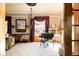 Cozy living room with hardwood floors, a piano, and natural light, perfect for relaxation and entertainment at 1275 N Franklin St, Denver, CO 80218
