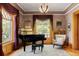 Bright living room features a piano, large windows with drapes, and comfortable seating at 1275 N Franklin St, Denver, CO 80218