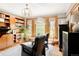 Inviting living room with wood floors, built-in bookshelf, and a large bay window at 1275 N Franklin St, Denver, CO 80218