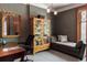 Charming office space features decorative wallpaper, large bookcase, and plenty of natural light at 1275 N Franklin St, Denver, CO 80218