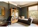 Traditional style office with wallpaper, hardwood floors, and a chaise lounge in front of window at 1275 N Franklin St, Denver, CO 80218