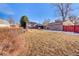 Spacious backyard featuring a lawn, patio, and a detached garage at 2551 S Carson Way, Aurora, CO 80014
