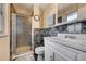 Cozy bathroom featuring a tile shower and vanity sink at 2551 S Carson Way, Aurora, CO 80014