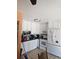 Bright kitchen featuring white cabinets and appliances with tile flooring at 2551 S Carson Way, Aurora, CO 80014