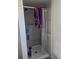 Walk-in shower featuring gray tile walls with a shower curtain for privacy at 2551 S Carson Way, Aurora, CO 80014