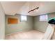 Finished basement space featuring neutral carpet, natural light, and ample room for activities and storage at 11651 E Yale Way, Aurora, CO 80014